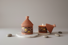 Load image into Gallery viewer, Decorative terracotta pot candles with lid, with Bogolan-inspired geometric patterns, on a marble surface.