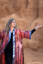 Carregar imagem no visualizador da galeria, Girl wearing a tie dye kimono against an earthen background and lifting her arm