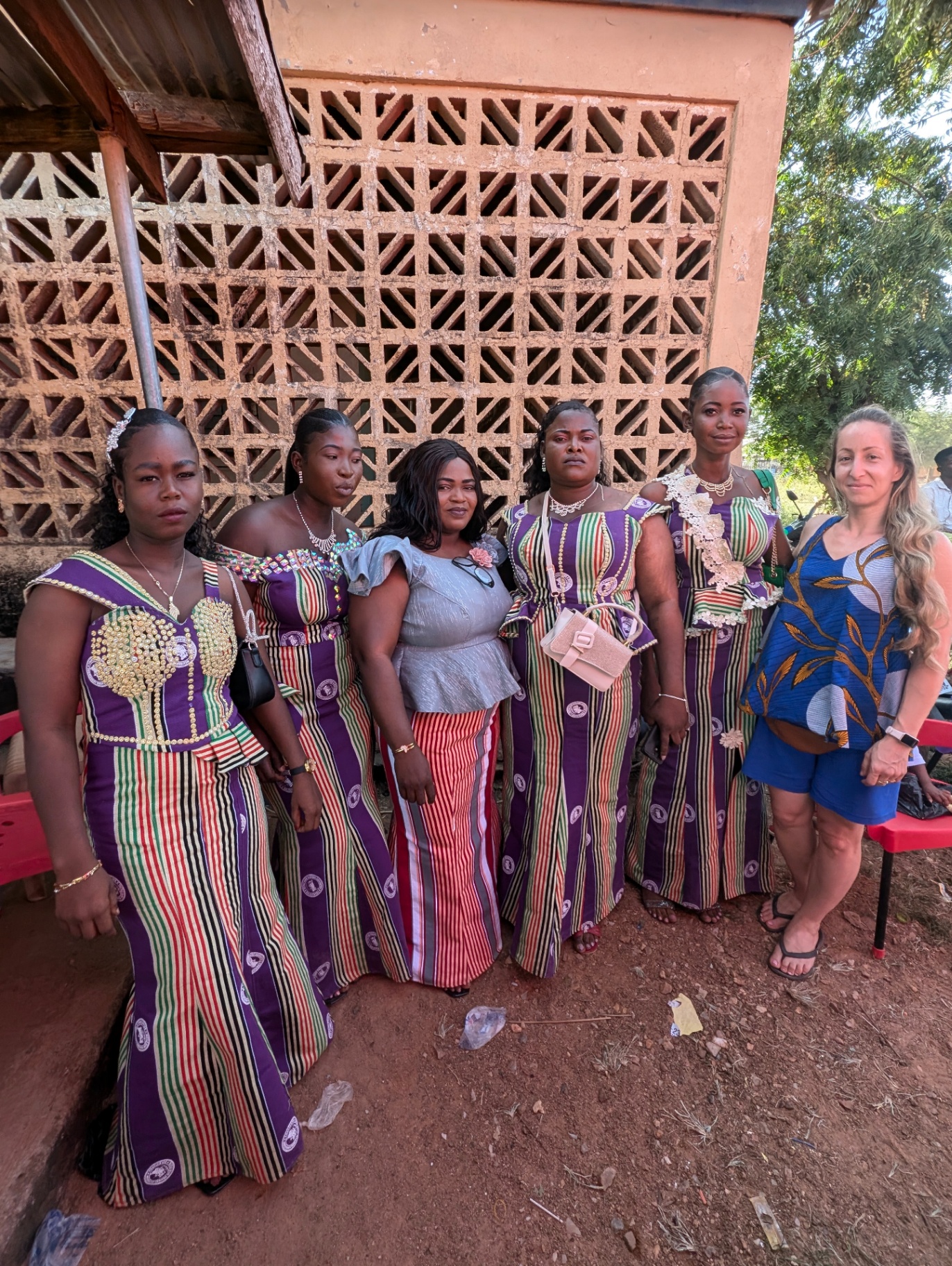 A group of women wearing vibrant handwoven striped textiles in Northern Ghana.