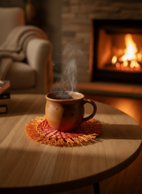 Load image into Gallery viewer, Mug on pink orange woven coaster next time fireplace

