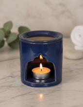 Carregar imagem no visualizador da galeria, Navy blue Moroccan ceramic oil burner on a white marble countertop
