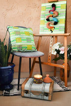 Load image into Gallery viewer, green wax print cushion on a chair, in an artsy decor
